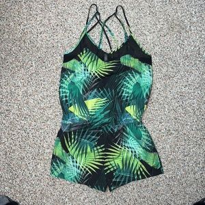Fabletics Romper Size Small Black and green foliage.
